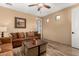 Cozy living room featuring wood-look flooring, comfortable sofa, and accent furniture at 13336 W Via Caballo Blanco --, Peoria, AZ 85383