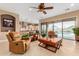 Open-concept living room with access to a kitchen and outdoor pool area at 13336 W Via Caballo Blanco --, Peoria, AZ 85383