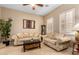 Inviting living room with neutral tones, comfortable seating, and shuttered windows at 13336 W Via Caballo Blanco --, Peoria, AZ 85383