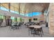 A community meeting space offers a fireplace, large windows, and an abundance of tables and seating at 13336 W Via Caballo Blanco --, Peoria, AZ 85383