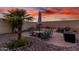 Outdoor patio features a table, seating, and desert landscaping at 13336 W Via Caballo Blanco --, Peoria, AZ 85383