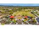 Aerial view of a community playground with shaded play structures, open fields, and mountain views in the background at 13336 W Via Caballo Blanco --, Peoria, AZ 85383