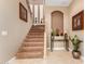 Inviting staircase with neutral carpet and decorative accents at 13336 W Via Caballo Blanco --, Peoria, AZ 85383