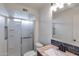 Modern bathroom featuring new shower with glass door, updated vanity, and sleek fixtures, enhancing the space at 1410 W Morrow Dr, Phoenix, AZ 85027