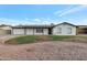 Charming single-story home with desert landscaping and a freshly painted exterior, exuding curb appeal at 1410 W Morrow Dr, Phoenix, AZ 85027