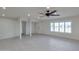 Bright living space featuring light tile floors, modern lighting, and neutral paint, creating a welcoming atmosphere at 1410 W Morrow Dr, Phoenix, AZ 85027