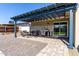 Backyard featuring a covered pergola, BBQ grill, string lights, and pavers, for outdoor enjoyment at 14842 N 36Th St, Phoenix, AZ 85032