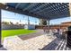 Backyard featuring a covered patio, artificial turf, and a storage shed at 14842 N 36Th St, Phoenix, AZ 85032