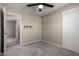 Bedroom offering carpeted floors, standard closet and fan, complemented by fresh paint and ample natural light at 14842 N 36Th St, Phoenix, AZ 85032