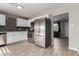 Modern kitchen featuring stainless steel appliances and sleek gray backsplash at 14842 N 36Th St, Phoenix, AZ 85032
