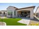 Backyard featuring a covered patio, artificial turf and gravel landscaping at 156 E Leverenz Ave, Queen Creek, AZ 85140