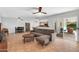 Spacious living room with tile floors, comfortable seating, and sliding door access to patio at 1643 W Harmont Dr, Phoenix, AZ 85021