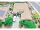 Aerial view of a charming home featuring a two-car garage and well maintained landscape at 17985 W Jojoba Rd, Goodyear, AZ 85338