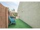 Artificial grass lawn in backyard surrounded by block walls, ideal for low-maintenance outdoor activities and space at 17985 W Jojoba Rd, Goodyear, AZ 85338