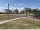 Outdoor basketball court with multiple hoops and a well-maintained playing surface at 17985 W Jojoba Rd, Goodyear, AZ 85338
