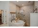 Serene bathroom with a soaking tub and separate glass-enclosed shower at 17985 W Jojoba Rd, Goodyear, AZ 85338