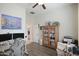 Versatile bedroom with wood-look floors and home office setup at 17985 W Jojoba Rd, Goodyear, AZ 85338