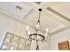 Interior shot of a room featuring a chandelier with an interesting round wrought iron design at 17985 W Jojoba Rd, Goodyear, AZ 85338