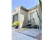 Charming courtyard view featuring a fountain, potted plants, and a neutral color palette at 17985 W Jojoba Rd, Goodyear, AZ 85338