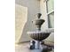 Beautiful three-tiered water fountain feature with decorative details in courtyard area at 17985 W Jojoba Rd, Goodyear, AZ 85338