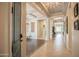 Spacious foyer boasts elegant lighting, tile flooring, and seamless transitions to living spaces at 17985 W Jojoba Rd, Goodyear, AZ 85338