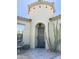 Inviting front door with a turret feature, desert landscaping, and water fountain at 17985 W Jojoba Rd, Goodyear, AZ 85338