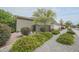 Charming front yard featuring desert landscaping, gravel, shrubs, and mature trees at 17985 W Jojoba Rd, Goodyear, AZ 85338