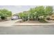 Charming single story home featuring mature trees, desert landscaping and a three-car garage at 17985 W Jojoba Rd, Goodyear, AZ 85338