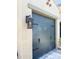 Stylish garage door with lantern and decorative handle details at 17985 W Jojoba Rd, Goodyear, AZ 85338