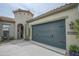 A well-maintained home featuring a spacious two-car garage and an inviting entrance at 17985 W Jojoba Rd, Goodyear, AZ 85338