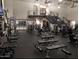 Well-equipped fitness center with modern exercise machines and a staircase to a second level at 17985 W Jojoba Rd, Goodyear, AZ 85338