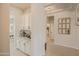 Hallway space featuring a coffee bar setup with granite countertops and overhead lighting, perfect for entertaining at 17985 W Jojoba Rd, Goodyear, AZ 85338