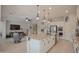 Modern kitchen features a large island, stainless steel appliances, and open access to the living room at 17985 W Jojoba Rd, Goodyear, AZ 85338