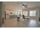 Open-concept living room with ample seating, great natural light, and seamless kitchen access at 17985 W Jojoba Rd, Goodyear, AZ 85338