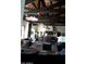 Comfortable lounge area featuring exposed beams, stylish lighting, and upscale furnishings at 17985 W Jojoba Rd, Goodyear, AZ 85338