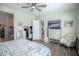 Spacious main bedroom features a ceiling fan, walk-in closet and ensuite bath at 17985 W Jojoba Rd, Goodyear, AZ 85338