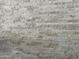 Close up of a stacked stone accent wall with neutral colors and varying stone sizes at 17985 W Jojoba Rd, Goodyear, AZ 85338