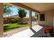 Enjoy a covered patio, lush green grass and a sparkling pool beyond a secure fence at 18325 W Port Au Prince Ln, Surprise, AZ 85388
