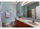 Cozy bathroom with a large mirror, neutral countertop, and shower-tub combination at 18325 W Port Au Prince Ln, Surprise, AZ 85388