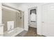 Bright bathroom features glass enclosed shower, toilet and tile flooring at 18325 W Port Au Prince Ln, Surprise, AZ 85388