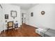 Bright bedroom features wood flooring, daybed and desk at 18325 W Port Au Prince Ln, Surprise, AZ 85388