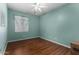 Bedroom featuring laminate floors, neutral walls, and a ceiling fan at 18325 W Port Au Prince Ln, Surprise, AZ 85388
