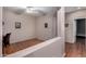 Bonus room with wood-look floors and a view to another room at 18325 W Port Au Prince Ln, Surprise, AZ 85388