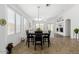 Bright dining area featuring a modern table and seating, with an open layout, ideal for entertaining and Gathering meals at 18325 W Port Au Prince Ln, Surprise, AZ 85388
