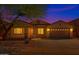 Charming single-Gathering home showcasing a well-maintained front yard and inviting curb appeal at twilight at 18325 W Port Au Prince Ln, Surprise, AZ 85388