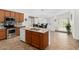 Spacious kitchen with an island, stainless steel appliances, and adjacent dining area, perfect for modern living at 18325 W Port Au Prince Ln, Surprise, AZ 85388