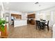 Open concept kitchen featuring stainless steel appliances, island, and dining area, creating a welcoming and functional space at 18325 W Port Au Prince Ln, Surprise, AZ 85388