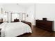 Spacious main bedroom with hardwood floors and ensuite bathroom at 18325 W Port Au Prince Ln, Surprise, AZ 85388