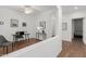 Bright home office with wood-look floors, white walls, and modern furniture at 18325 W Port Au Prince Ln, Surprise, AZ 85388