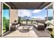 Expansive balcony featuring comfortable seating, offering breathtaking views of the surrounding desert landscape at 18720 N 101St St # 3006, Scottsdale, AZ 85255